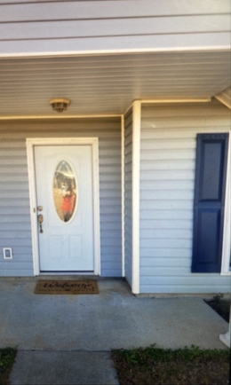 Image of a white front door submitted as a proof-of-delivery photo